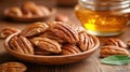 Honey-glazed pecans on wooden plate, honey jar in background Royalty Free Stock Photo