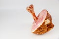 Honey glazed pork ham with big bone on white background Royalty Free Stock Photo