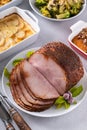 Honey glazed spiral sliced ham with side dishes for a celebration dinner Royalty Free Stock Photo