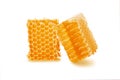 Honey in honeycomb two pieces isolated on white background Royalty Free Stock Photo