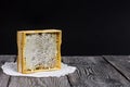 Honey in honeycombs in a wooden frame. On black pine boards. On a black background Royalty Free Stock Photo