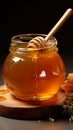 Honey jar, companioned by wooden dipper a pairing for indulgence in sweetness