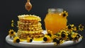 Honey jar. Dips wooden stick to glass bowl with liquid floral fresh honey