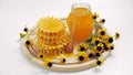 Honey jar. Dips wooden stick to glass bowl with liquid floral fresh honey