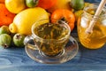 Honey jar and fresh apples with pomegranate over green bokeh background Royalty Free Stock Photo