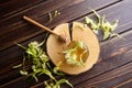 Honey in jar with linden flowers and honey dipper on wooden background Royalty Free Stock Photo