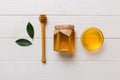 Honey jar with wooden honey dipper on white background top view with copy space. Delicious honey bottle Royalty Free Stock Photo