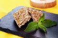 Honey kozinaki sunflower with mint graphite board still life close-up Sesame seed brittle Royalty Free Stock Photo