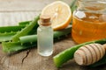 Honey, lemon, aloe vera leaves and essential oil for homeopathy remedy, alternative medicine closeup