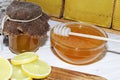 Honey and lemon. Honeycomb in the background-the natural medicine Royalty Free Stock Photo