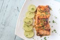 Honey lime salmon on the plate Royalty Free Stock Photo