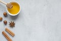 Honey liquid and anise with cinnamon on a light background. Copy space for text. Royalty Free Stock Photo