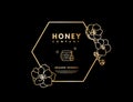 Honey logo with gold gradient honeybee, beehive and honey stick in frame hexagon with flower. Label banner for company