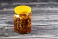 Honey with mixed nuts, walnuts, hazelnuts, almonds and cashews in natural honey, which is a sweet and viscous substance made by Royalty Free Stock Photo