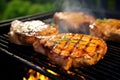 honey mustard pork chops on a sizzling grill outdoors