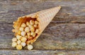 Honey peanuts closeup in sugar cones