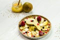 Honey pear pie ready for baking. Uncooked pear tart made of sprouted green buckwheat and whole grain flour with berries