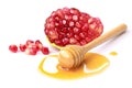 Pomegr.anate with honey isolated on white Royalty Free Stock Photo