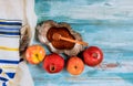 Honey on the pomegranate and apples. Jewish new year Yom Kippur and Rosh Hashanah kippah yamolka and shofar