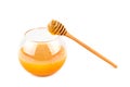 Honey pot and dipper isolated on white background Royalty Free Stock Photo