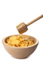 Honey pouring over cornflakes isolated Royalty Free Stock Photo