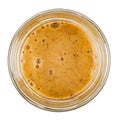 Honey with sea buckthorn in a glass jar. Isolated on a white background. View from the top