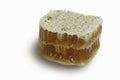 Honey slice isolated on white background. Natural beehive. Honeycomb piece with clipping path Royalty Free Stock Photo