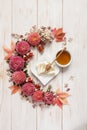 Honey, soft cheese and figs on white wooden background surrounded by floral pattern of pink flowers and leaves. Top Royalty Free Stock Photo