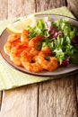 Honey soy shrimp and fresh salad close-up on a plate. vertical Royalty Free Stock Photo