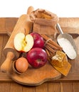 honey spoon, jar of honey, apples and cinnamon on a wooden background in a rustic style Royalty Free Stock Photo