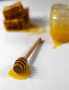 Honey spoon, honey jar and honeycomb Royalty Free Stock Photo