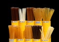 Honey Straws of various flavors in a yellow display