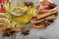 Honey and tea. cup of herbal tea with lemon, honey, dried citruses, anise stars and cinnamon sticks on a wooden table. hot tea for Royalty Free Stock Photo
