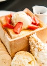 Honey toast with strawberry and vanilla ice cream. Royalty Free Stock Photo