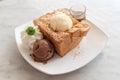 Honey toast with vanilla, chocolate ice-cream, whipped cream and Royalty Free Stock Photo