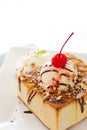 Honey toast with vanilla ice cream and chocolate sauce : partial Royalty Free Stock Photo