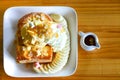 Honey toast with vanilla ice cream and marshmallow on  whipped cream,  served with banana and chocolate syrup Royalty Free Stock Photo