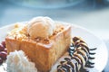 Honey toast with vanilla ice cream, whipped cream and chocolate syrup Royalty Free Stock Photo