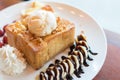 Honey toast with vanilla ice cream, whipped cream and chocolate syrup Royalty Free Stock Photo