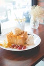 Honey toast with vanilla ice cream, whipped cream and chocolate syrup Royalty Free Stock Photo