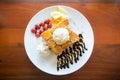 Honey toast with vanilla ice cream, whipped cream and chocolate syrup Royalty Free Stock Photo