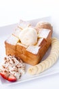 Honey toast with vanilla ice-cream and whipping cream, honey, Strawberry and banana slices