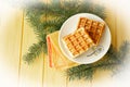 Honey traditional golden waffle on wooden yellow table, delicious morning breakfast, flat lay bright image Royalty Free Stock Photo