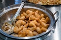 Asian shrimp in honey walnut sauce served in metal wok Royalty Free Stock Photo