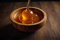 Honey in a wooden bowl Royalty Free Stock Photo