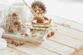 Honey in the wooden bowl, hazelnuts and jar with milk on the wooden tray Royalty Free Stock Photo