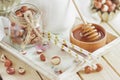 Honey in the wooden bowl, hazelnuts and jar with milk on the wooden tray Royalty Free Stock Photo