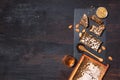 Honeycomb, bee pollen granules, honey jar with wooden dipper, almond nuts on black slate tray over dark background. Copy space. Royalty Free Stock Photo