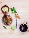 Honeycomb on ceramic plate with peppermint ,lime lemon,ginger an