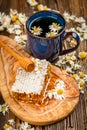 Honeycomb and chamomile tea Royalty Free Stock Photo
